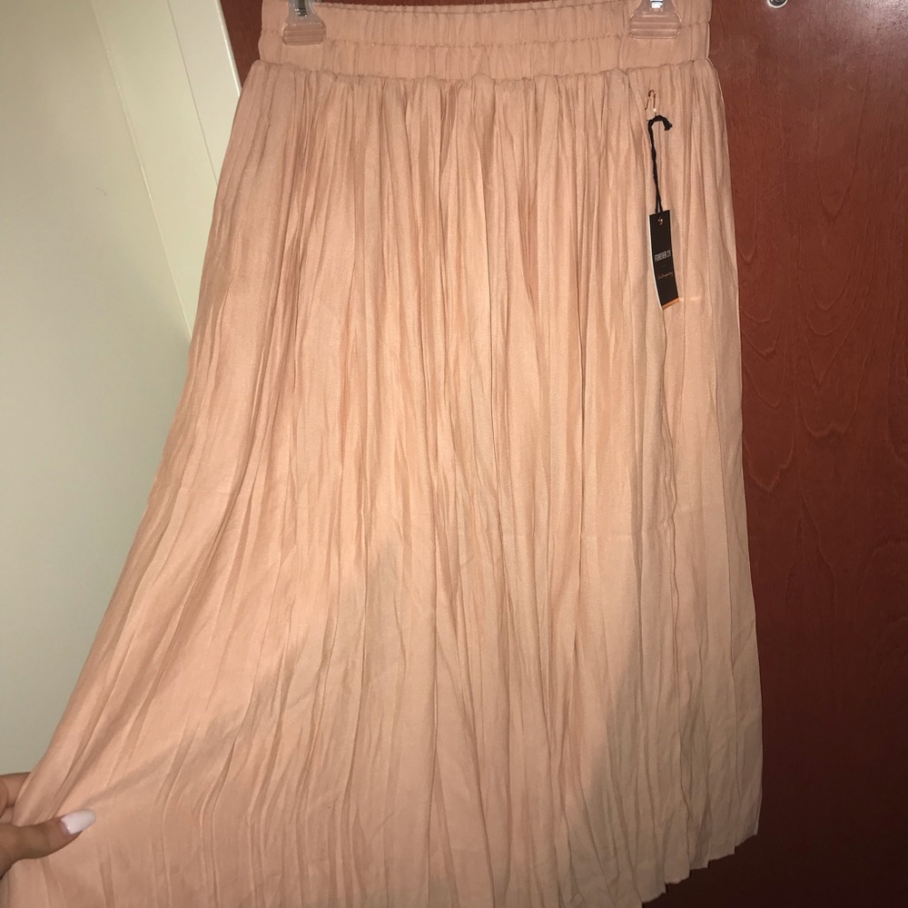 Mid length blush colored skirt
